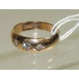 A Gents 9ct gold, three stone diamond gypsy ring, the diamonds one sixteen carat each approx. Ring