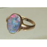 A 9ct Rose gold opal doublet ring, set with oval flat opal. Ring size L.