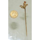 A 9ct gold tie pin with thistle finial set with seed pearls and two tiny rubies and a small gold USA