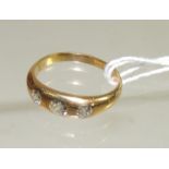 A Gents 18ct gold three stone diamond gypsy ring, the diamonds quarter carat each approx. Ring