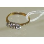 A ladies 18ct gold and platinum mounted three stone diamond ring. Each diamond quarter carat approx.