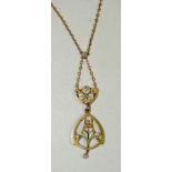 A 9ct gold pendant piece of Art Nouveau form with applied irresdescent glass leaves and set with