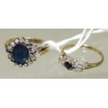 A ladies unmarked gold dress ring set with a central oval faceted sapphire with a surround of