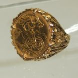 An Edward VII half Sovereign dated 1906, claw mounted in a 9ct gold ring. The ring with bark