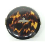 A RAF simulated tortoiseshell powder compact, the lid centre set with RAF wings, 8.5cms diam