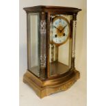 A 19th Century French Samuel Marti four glass cased mantel clock having circular cream enamel dial