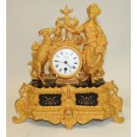 A 19th Century French gilt spelter mantel timepiece the white enamel dial inscribed "Rossiter Paris"