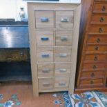 21ST CENTURY OAK 10 DRAWER CHEST ON SHAPED SUPPORTS 125CM TALL