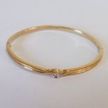 9CT GOLD HINGED BANGLE SET WITH SINGLE DIAMOND