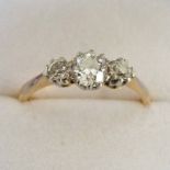 3-STONE DIAMOND RING IN CLAW SETTING MARKED 18CT
