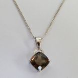 SMOKY QUARTZ PENDANT IN SETTING MARKED 9K ON FINE CHAIN MARKED 375