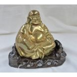 CHINESE BRASS BUDDHA ON A HARDWOOD STAND