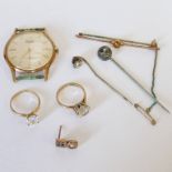 9CT GOLD WRISTWATCH, 2 ZIRCON SOLITAIRE RINGS - ONE MARKED 375, THE OTHER 10K. 9CT GOLD BAR BROOCH