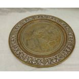 EASTERN BRASS CIRCULAR SALVER WITH ENGRAVED CENTRE SECTION & EMBOSSED BORDER- 28CM DIAMETER
