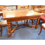 EARLY 20TH CENTURY MAHOGANY PULL-OUT DINING TABLE ON TURNED SUPPORTS