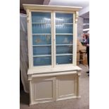 PAINTED MAHOGANY BOOKCASE WITH 2 GLASS PANEL DOORS OPENING TO SHELVED INTERIOR OVER 2 PANEL DOORS