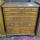 WALNUT TELEVISION CABINET SHAPED AS A CHEST OF DRAWERS ON BRACKET SUPPORTS 98CM TALL