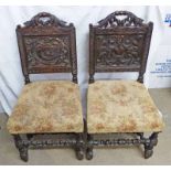 PAIR OF 19TH CENTURY OAK CHAIRS WITH DECORATIVE CARVED BACKS