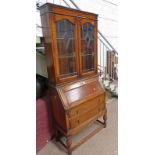 EARLY 20TH CENTURY OAK BUREAU BOOKCASE WITH 2 LEADED GLASS PANEL DOORS OVER FALL FRONT OVER 2