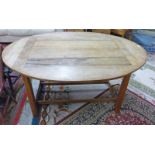 20TH CENTURY OVAL TOPPED DINING TABLE ON SQUARE SUPPORTS