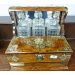 19TH CENTURY WALNUT TANTALUS DECANTER STAND WITH DECORATIVE BRASS MOUNTS 2 LIDS OPENING TO FITTED