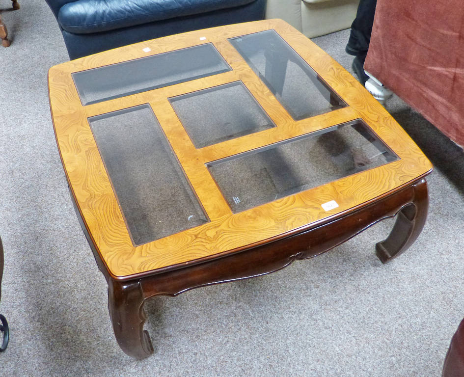 20TH CENTURY EASTERN GLASS TOPPED COFFEE TABLE ON SHAPED SUPPORTS