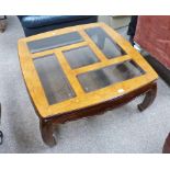 20TH CENTURY EASTERN GLASS TOPPED COFFEE TABLE ON SHAPED SUPPORTS