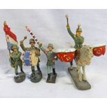 FOUR ELASTOLIN / LINEOL BANDSMEN FIGURES INCLUDING KETTLE DRUMMER, FLAG BEARER, DRUMMER AND BANDSMAN