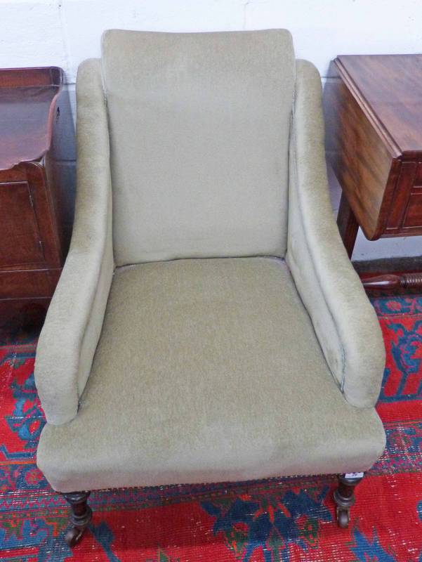 19TH CENTURY OVERSTUFFED ARMCHAIR ON TURNED SUPPORTS