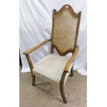 20TH CENTURY OAK OPEN ARMCHAIR WITH SHAPED BERGERE PANEL BACK ON SHAPED SUPPORTS