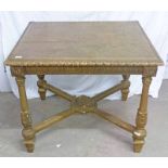 20TH CENTURY GILTWOOD SQUARE TOPPED TABLE WITH CARVED DECORATION ON TURNED SUPPORTS