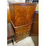 20TH CENTURY MAHOGANY BOW FRONT COCKTAIL CABINET WITH 2 PANEL DOORS OVER 4 DRAWERS ON BRACKET