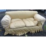 20TH CENTURY OVERSTUFFED DROP END SETTEE WITH YELLOW UPHOLSTERY RAISED ON OAK SQUARE SUPPORTS