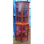 20TH CENTURY MAHOGANY BOW FRONT CORNER CABINET OF 4 GLASS PANEL DOORS ON SQUARE TAPERED SUPPORTS