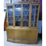 20TH CENTURY OAK BREAKFRONT BOOKCASE WITH 4 ASTRAGAL GLAZED DOORS OVER 4 PANEL DOORS ON PLINTH BASE