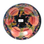 An early Moorcroft pomegranate pattern bowl, signed to base (hairline)