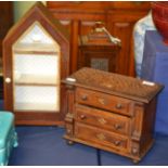 A miniature oak chest of drawers and a glazed cabinet with pitched top (2)