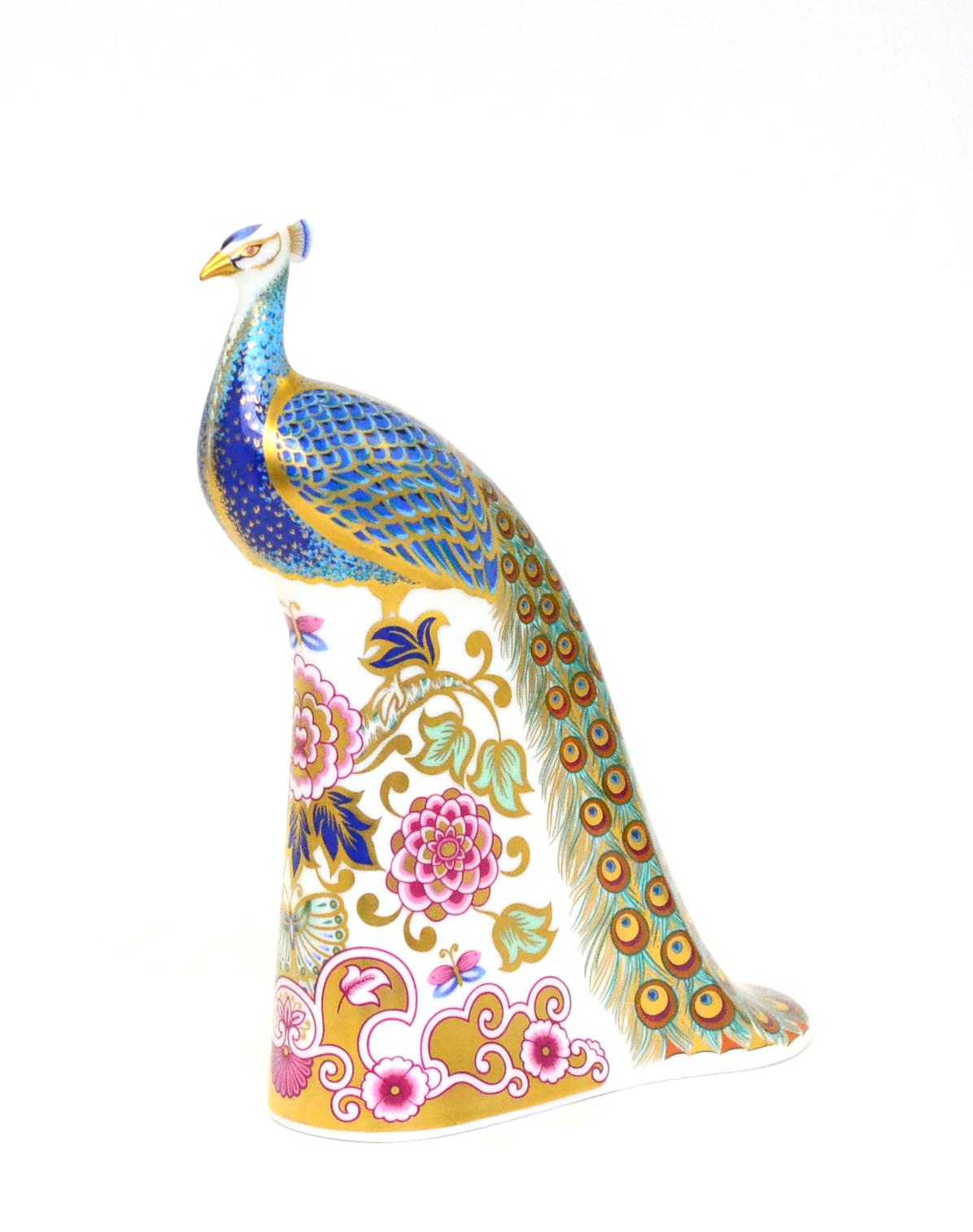 A Royal Crown Derby paperweight, Derby Peacock (27/750 and with gold stopper)In good structural