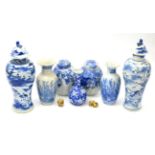 A group of Oriental items including, a pair of blue and white covered vases, a pair of blue and