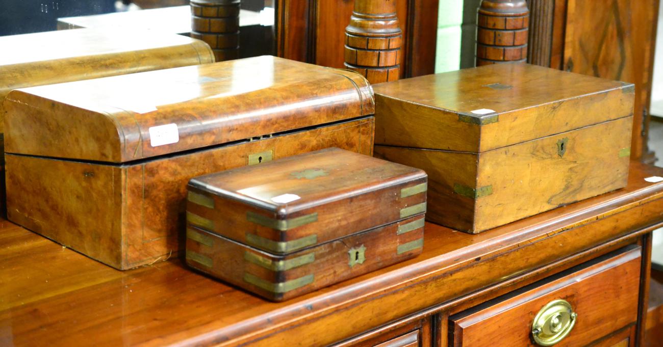 Three 19th century boxes including a brass inlaid walnut writing slope and two mahogany examples