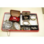 A quantity of costume jewellery containing chains, bangles and brooches, white metal chains with cl