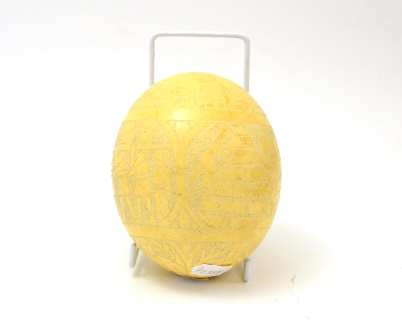 An ostrich egg carved with Egyptian scenes