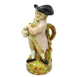 An 18th century pearlware Toby jug (lacking cover) (a.f.)