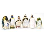 Six Royal Crown Derby paperweights including: Puffin (silver stopper), Emperor Penguin (gold
