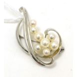 A Mikimoto pearl and white metal brooch