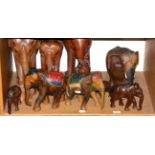 Nine carved wooden elephants of various sizes (9)