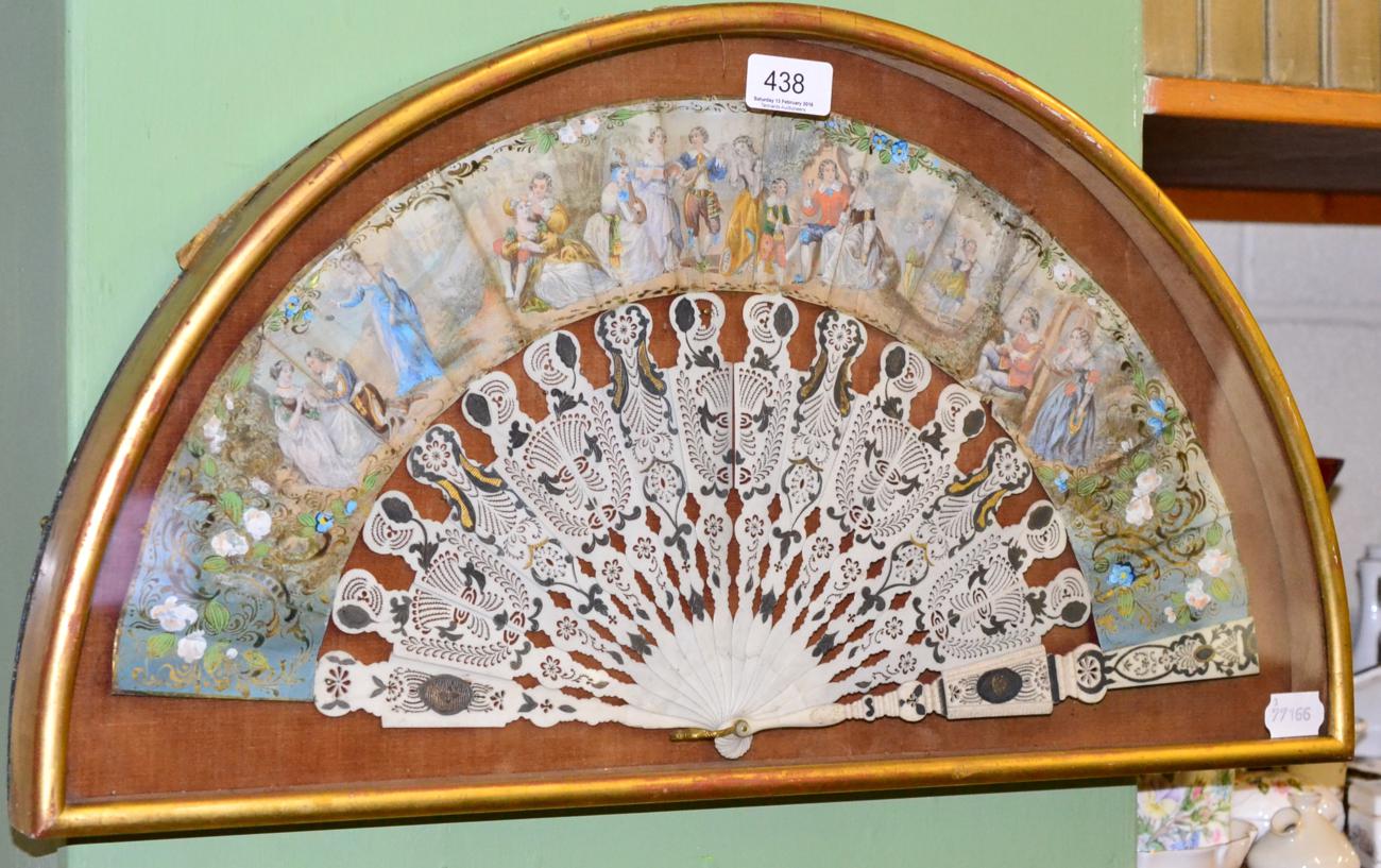 A 19th century ivory fan in a glazed case