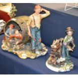 A Capodimonte figure group of apple pickers signed La Burla together with another Capodimonte figure