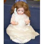 A German Bruno Schmidt bisque socket head doll, impressed '2097' '5.5', with original brown wig,