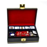 A quantity of costume jewellery in a black two tier case